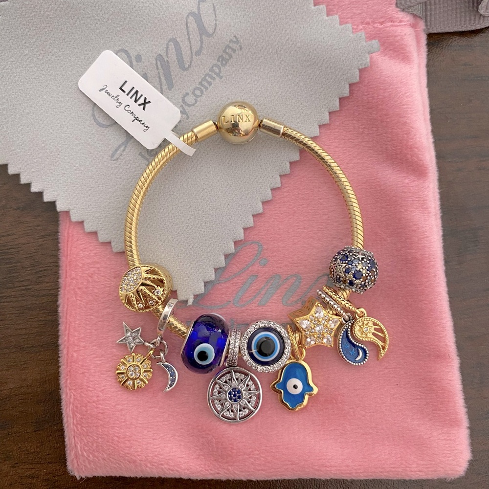 Linx Yellow Gold Snake Chain Bracelet with Hamsa and Evil Eye Themed Charms